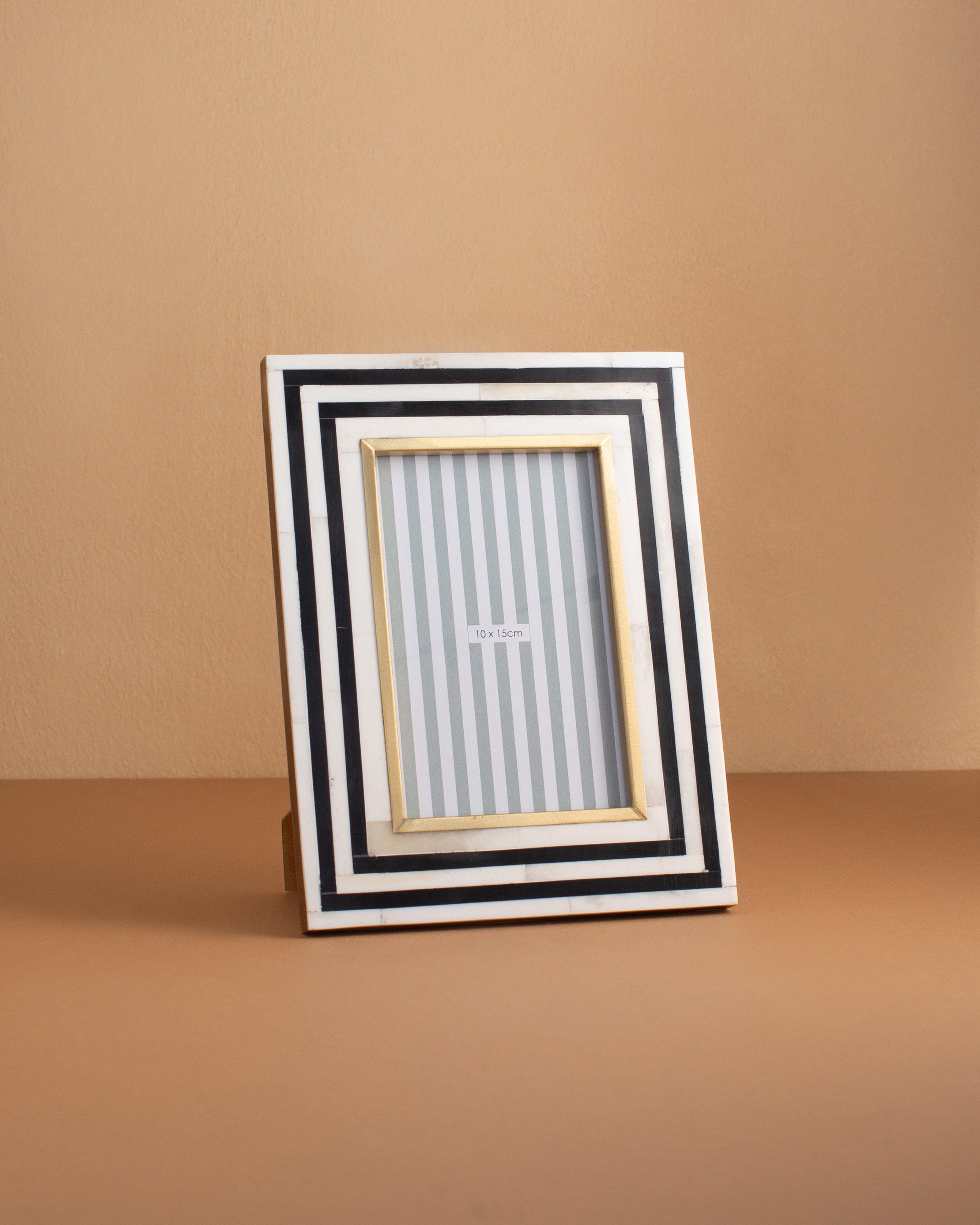Bone, Resin and Brass Border Frame Poetry Clothing Store